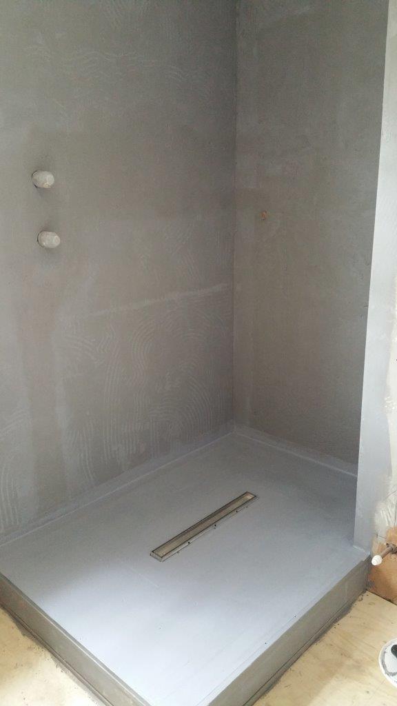 What is bathroom tanking diagram showing waterproof membrane layers under tiles